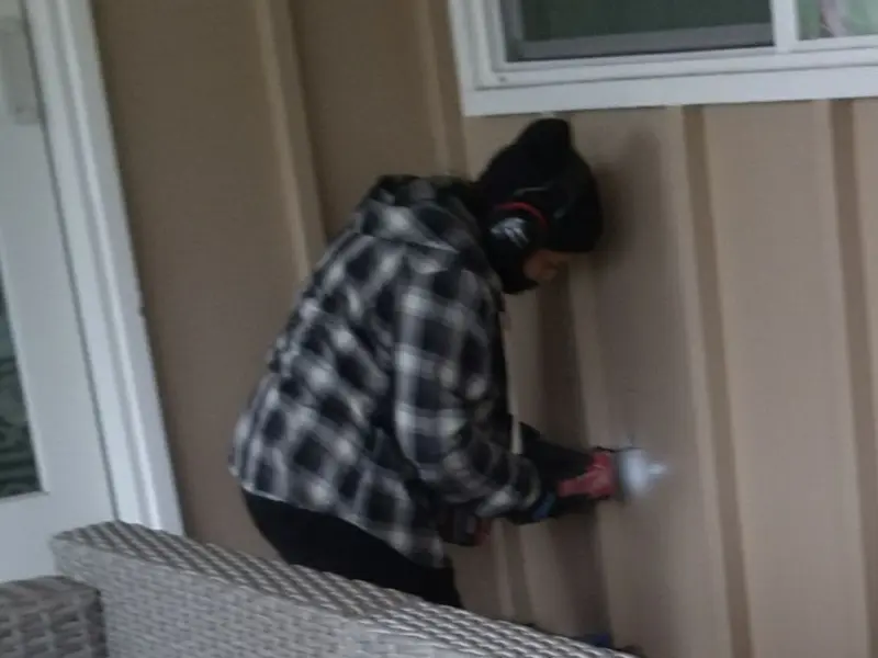 Professional electrician installing an exterior outlet in Enterprise